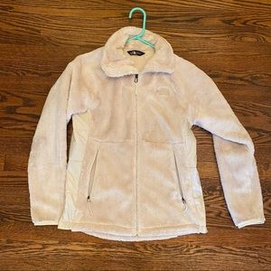 Cream colored North Face Jacket.